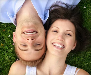 Smiling couple with healthy gums and teeth