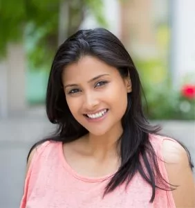 Woman benefits from Glidewell IO system and Itero same day dental crowns with Beveridge Dental in San Jose