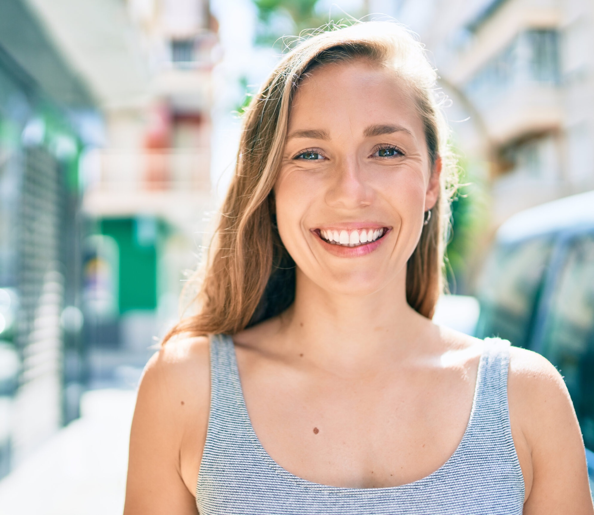 Woman smiling after getting cosmetic dentistry procedure at San Jose dentist office