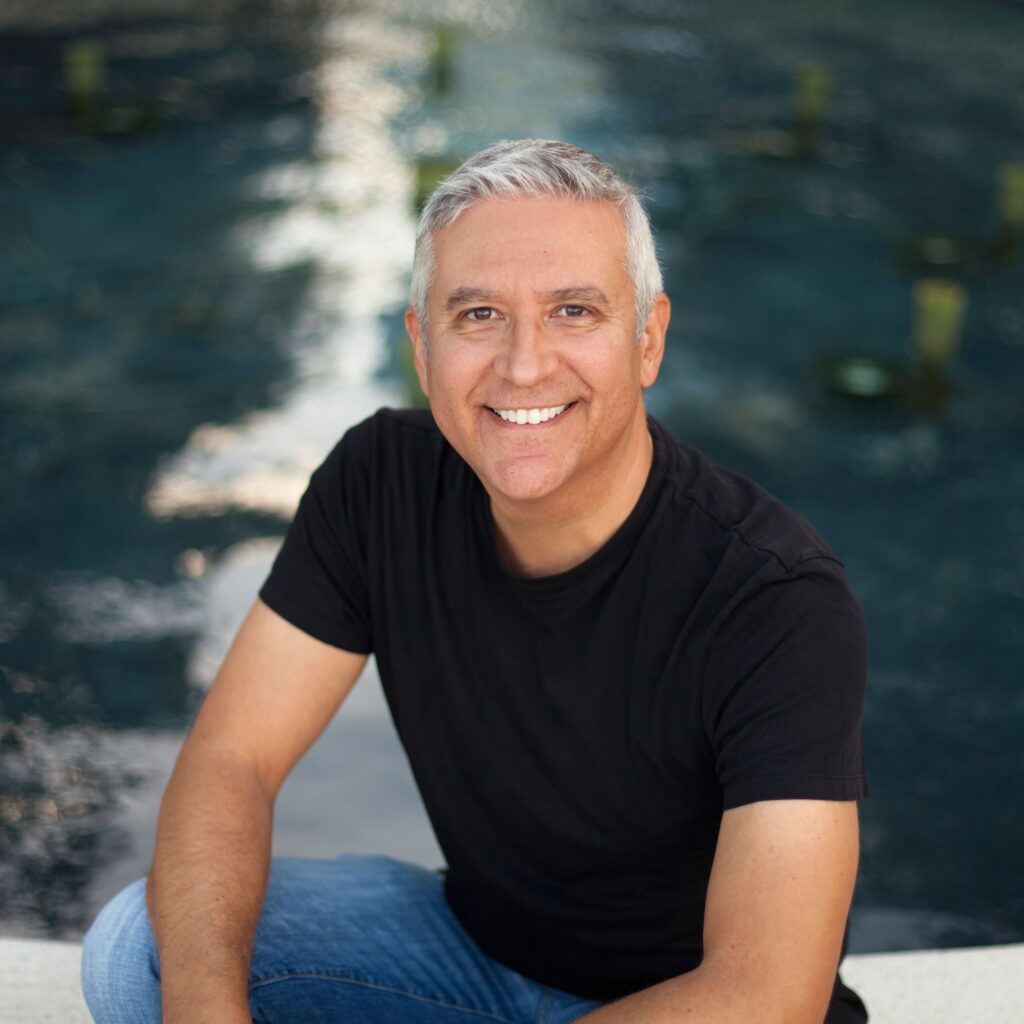 man smiling after getting dental implants in San Jose