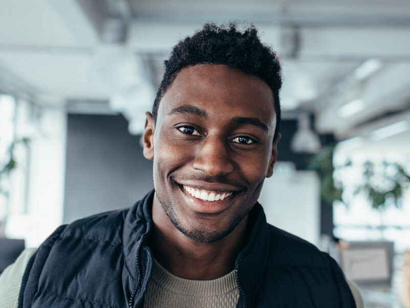 man with white teeth and perfect smile after seeing cosmetic dentist in San Jose