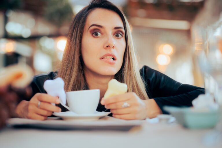 Woman worried about tooth staining from coffee. Stressed lady suffering from caffeine addiction concerned about her oral health